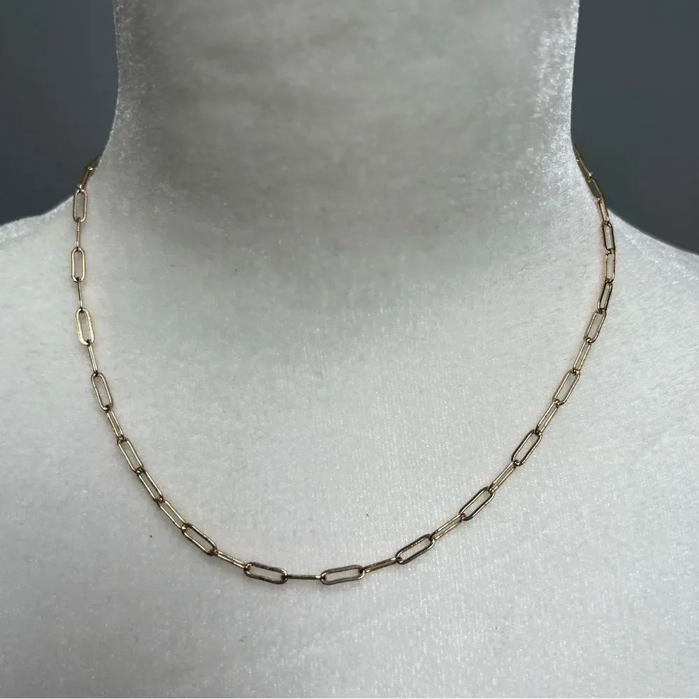 Gold tone chain link necklace with star pendant on back